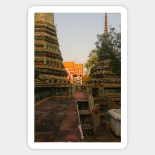 Second sidewalk view to ornate roof, flanked from parts of Chedis at Wat Pho. Sticker